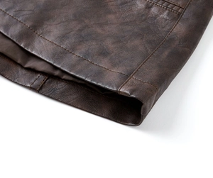 Detailed macro view of deep brown PU leather jacket cuff with durable double stitching