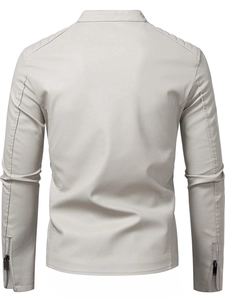 Detail of light gray faux leather jacket featuring quilted shoulders and metal zipper cuffs