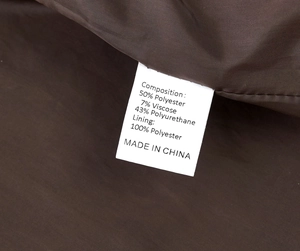 Detail shot of the garment care label showing material composition and washing instructions