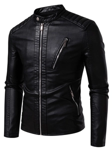 Detailed close-up of quilted shoulder pads and metallic collar button on faux leather jacket