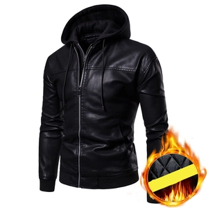Detail view of the quilted yellow insulated lining inside a black hooded PU leather jacket