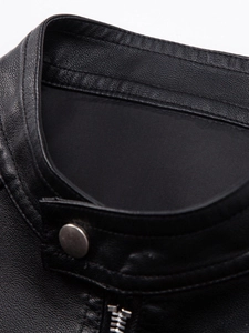 Macro view of men's faux leather jacket collar with pebble grain texture and metal snap button