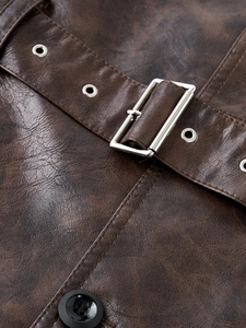 Macro shot of vintage dark brown PU leather jacket featuring metallic buckle and belt details