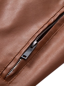 Close-up of brown PU leather texture and premium metal zipper detail on casual jacket