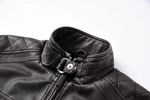 Detail of stand-up collar with adjustable buckle and quilted shoulders on black PU jacket