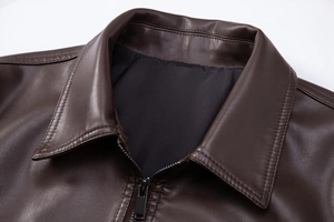 Close-up of the dark brown PU leather jacket collar and black metal zipper details