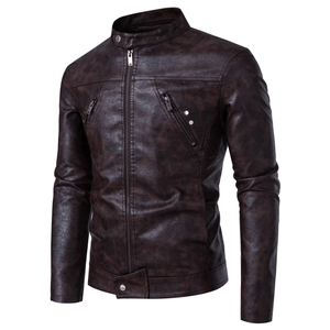 Detail of vintage brown faux leather jacket with stand collar and metallic zipper texture