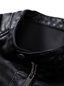 Close-up of black PU leather jacket with stand collar, silver snap button and metal zipper