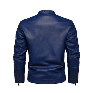Detail of quilted shoulders and metallic zipper cuffs on a men's navy blue biker jacket