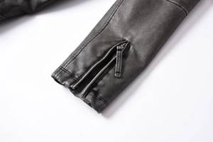 Detailed close-up of premium black PU leather jacket cuff with metal zipper closure