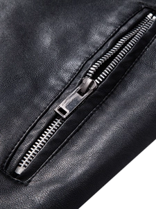 Close-up of premium black PU leather texture with a high-quality silver metal zipper detail