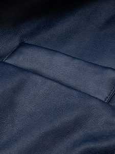 Detail shot of navy blue lychee texture PU leather pocket with fine precision stitching