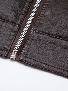 Close-up of brown PU leather jacket featuring silver zipper and precise stitching detail