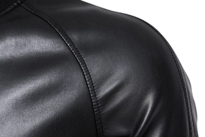 Detail view of premium black PU leather jacket shoulder with reinforced stitching