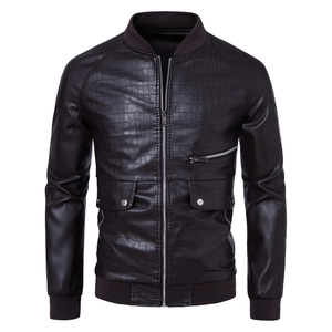 Detail of dark brown faux leather bomber jacket featuring crocodile embossed chest texture