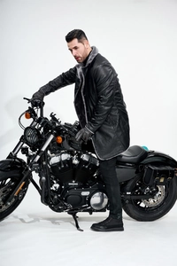 Detail view of men's leather jacket featuring a thick grey fleece collar and black PU texture