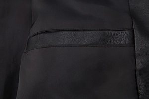 Detail of the high-quality synthetic leather lining and inner pocket stitching on men's jacket
