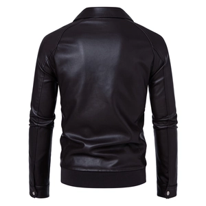 Detail view of the ribbed hem and back tailoring on a classic dark faux leather jacket