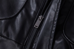 Close-up of the black PU leather texture and premium metal zipper of the biker jacket