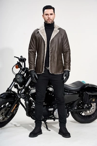 Detail of dark brown PU leather jacket with white faux shearling collar and warm lining