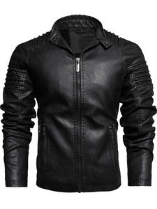 Detail of black motorcycle jacket featuring pleated shoulders and metal zipper pockets