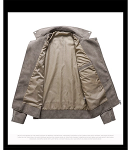 Detail view of smooth satin lining and interior zipper pocket of the leather jacket