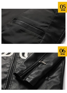 Detail view of leather jacket featuring white letter embroidery and metallic wrist zippers