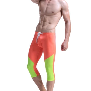 Men's quick-dry compression 3/4 leggings in orange and neon green with drawstring
