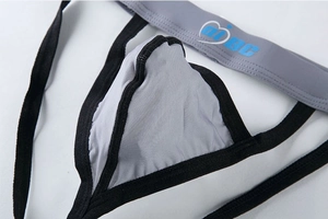 Macro shot of men's grey ice silk thong featuring ergonomic pouch and mBC elastic waistband