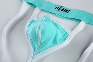 Detail of mint green men's thong featuring elastic waistband with heart logo