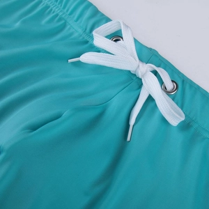 Turquoise men's quick-dry swimming shorts featuring drawstring waist and metal eyelets