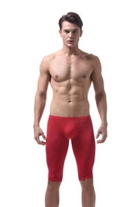 Close-up of red men's ice silk long boxer shorts with high-elasticity sports compression fabric