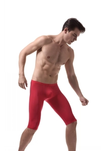 Detail view of men's red ice silk athletic compression shorts with elastic breathable fabric