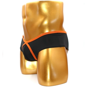 Men's athletic black trunks with orange trim detail shown on a golden male mannequin