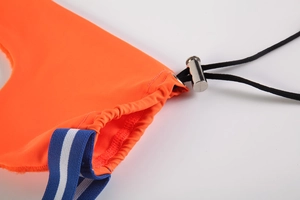 Detail of orange men's thong with silver metal toggle and blue striped elastic band