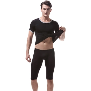 Detail of men's quick-dry ice silk sport set showing grey piping on black t-shirt and shorts