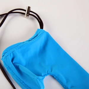 Macro detail of breathable light blue fabric with adjustable black drawstring and metal ring