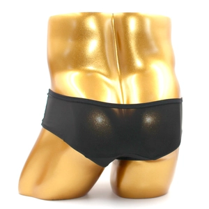Detail of black men's silk boxer briefs on a golden mannequin for a perfect fit