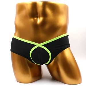 Front view of black men's boxers featuring neon green trim and ring cutout design