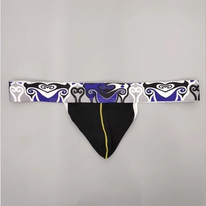 Detail of men's thong featuring wide elastic patterned waistband and yellow contrast stitching