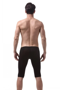 Detail view of men's black ice silk slim-fit shorts showing elastic fabric from the back