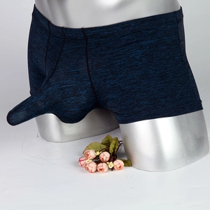 Detailed close-up of dark blue textured boxer briefs with an ergonomic pouch design
