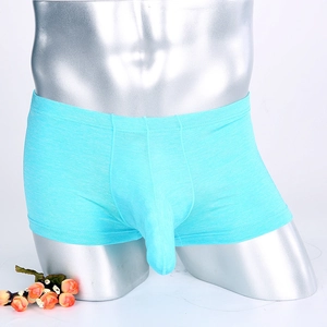 Detail view of the ergonomic U-convex pouch on men's blue seamless boxer briefs