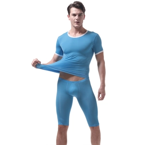 Detail shot showing the high elasticity and texture of men's blue ice silk athletic set