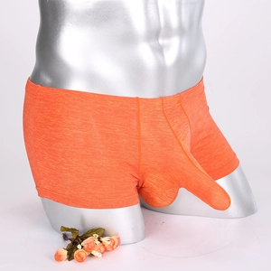 Detailed view of orange boxer briefs with unique elongated pouch and ribbed texture