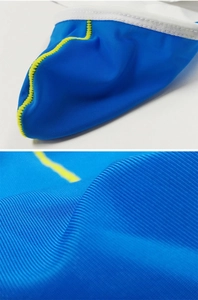 Macro detail of blue ice silk fabric with neon stitching and ribbed texture on men underwear
