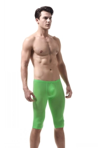 Close-up of bright green ice silk sports shorts showing ergonomic seams and stretch