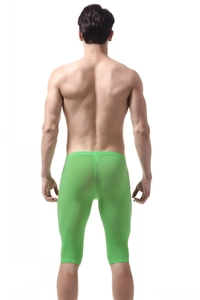 Rear view of bright green ice silk compression shorts showing elastic fit and fabric