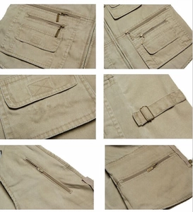 Vue détaillée du gilet en toile de coton kaki avec poches multiples et fermetures éclair