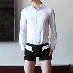 Detail of white long sleeve shirt tucked into black elastic boxer briefs for men